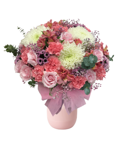 pink roses,light pink carnations,purple dotted chrysanthemums,white disbuds,pink astromeria,eucalyptus leaves in vase