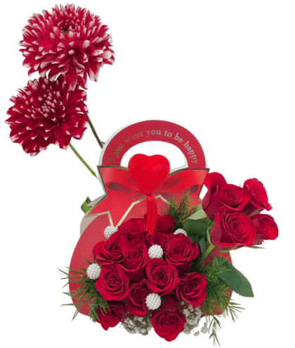 red roses with red Dalia and heart topper arrangement in hand bag
