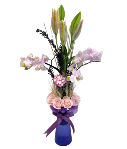 Venda orchids , purple shaded carnation, pink lily in vase